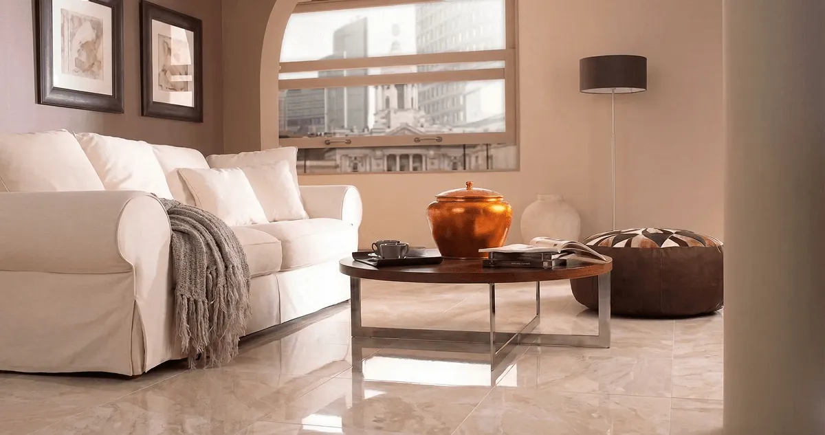 Modern living room with professionally installed marble flooring, a beige sofa, coffee table in Sacramento, CA